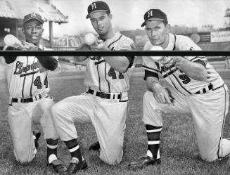 Hank Aaron, Eddie Mathews, and Joe Adcock Posing with Bats photograph, 1957 October