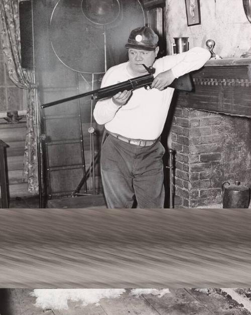 Babe Ruth Holding a Rifle photograph, 1936