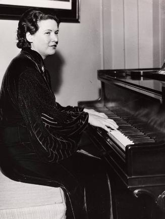 Claire Ruth Playing Piano photograph, undated