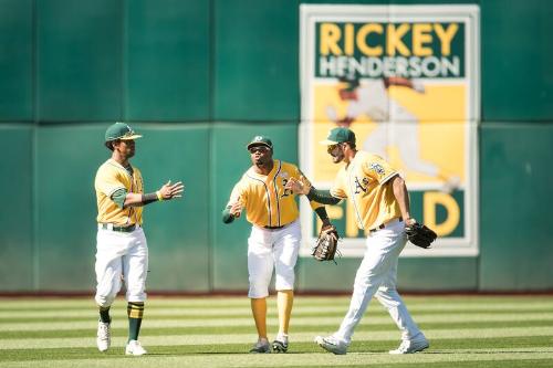 Khris Davis, Rajai Davis, and Matt Joyce Celebrating photograph, 2017 June 03