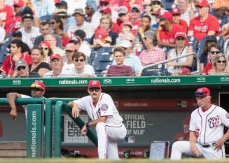 Jacque Jones, Mike Maddux, and Chris Speier Standing in the Dugout photograph, 2017 June 11