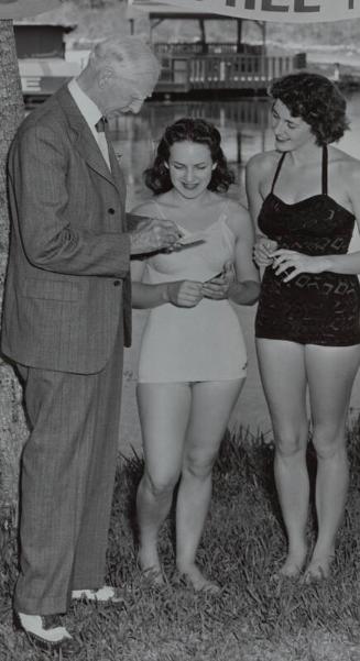 Connie Mack Signing Autographs photograph, 1949 February 27