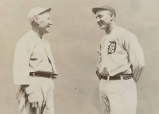 Hughie Jennings Looking at Ty Cobb photograph, 1921 or 1922