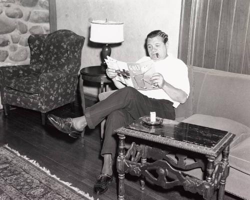 Babe Ruth Reading a Golf Magazine photograph, 1940 April 11