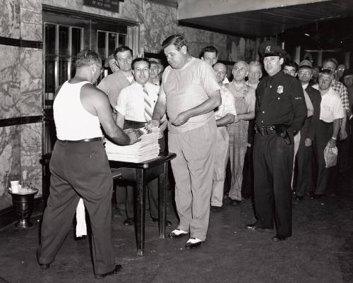 Babe Ruth Buying the Daily News During Delivery Strike photograph, 1945 August 04