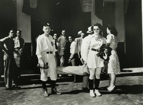 Johnny Rawlings and Doris Tetzlaff Carrying Bats photograph, 1947