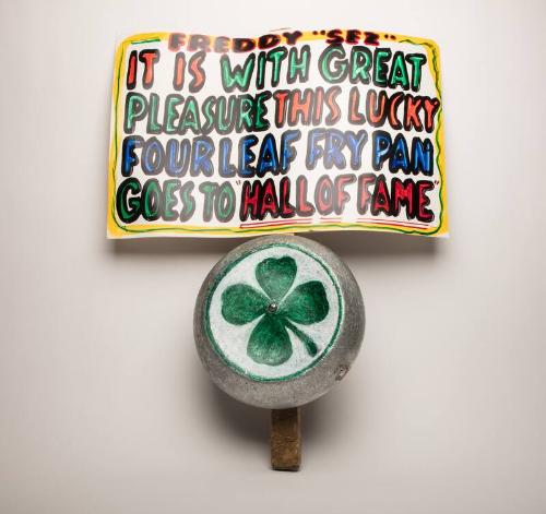 Frying pan and sign used by a New York Yankees fan